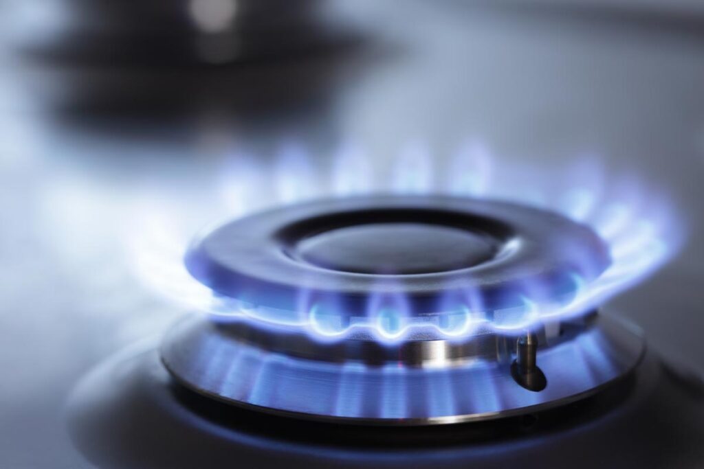 Close up of a gas stove burner, representing the Sub-Zero and Wolf gas stove pollutant risk class action.
