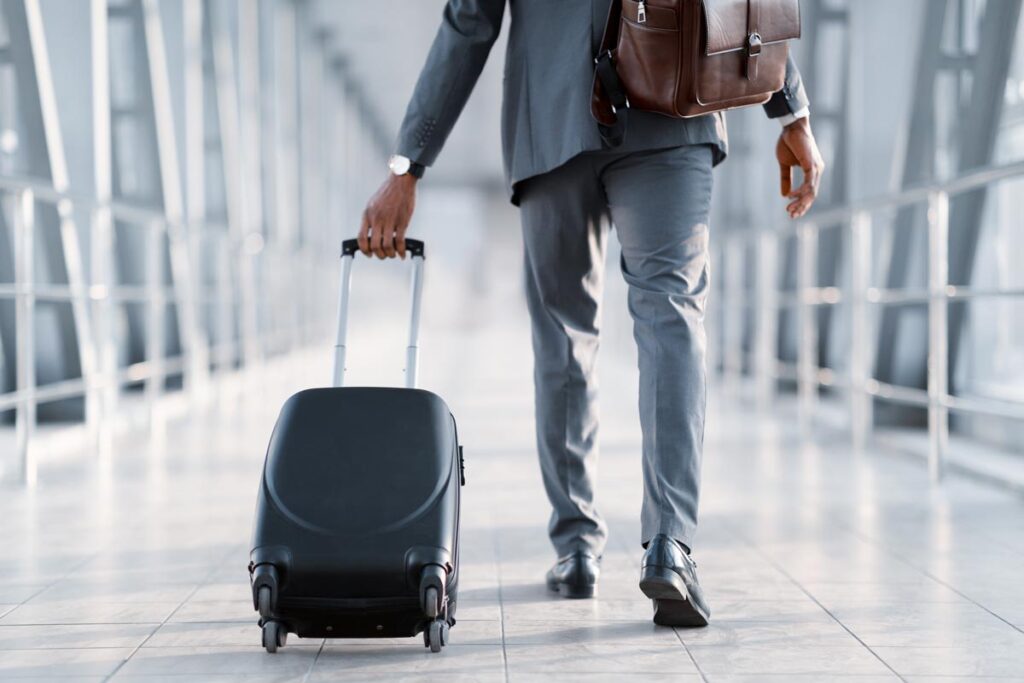An airlines passenger walking in an airport, representing an airlines lawsuit.