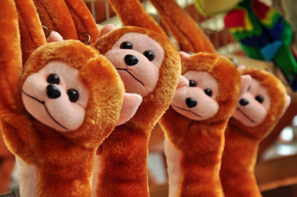 Close up of stuffed monkey plush animals.