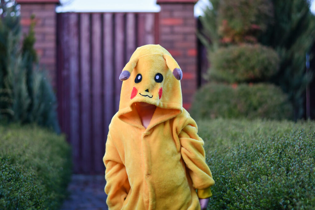 A young child wearing pikachu pajamas, Representing the Pokémon pajamas recall.