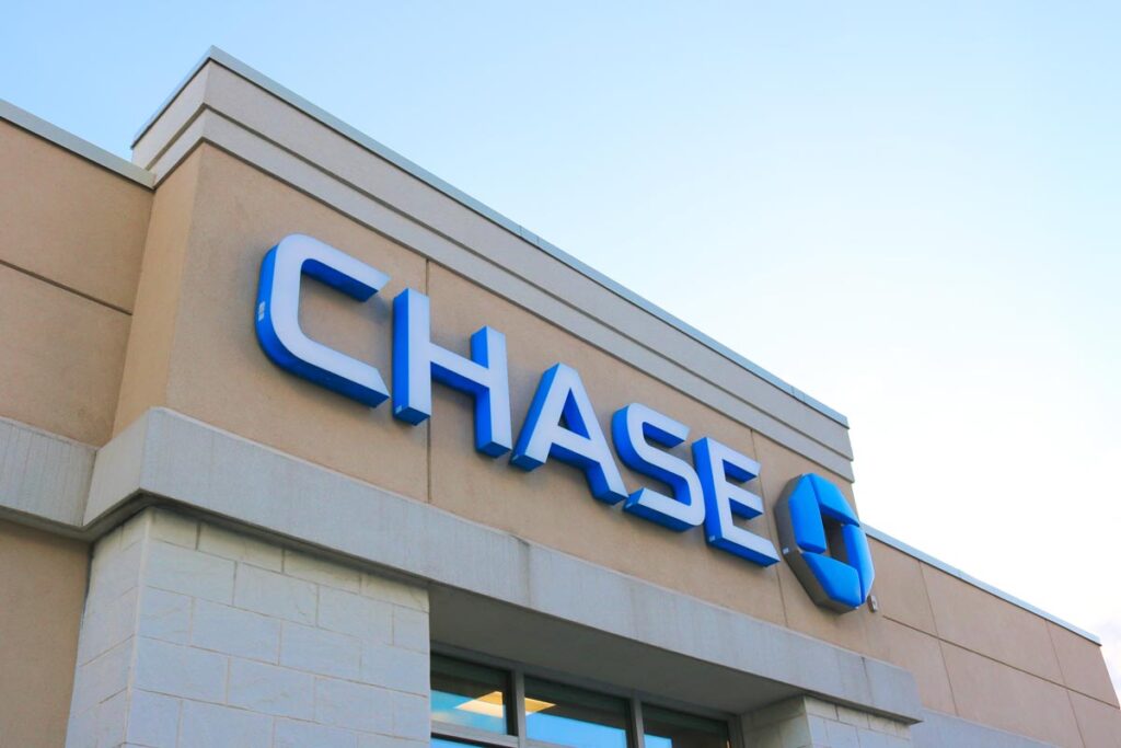 Close up of Chase bank signage against a blue sky, representing the Chase Bank Zelle fraud class action.