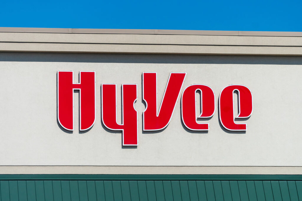 A close-up of the Hy-Vee sign against a blue sky.