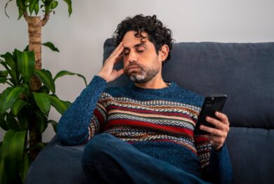 Man upset with texts, This represents the frustration of opting out of receiving annoying spam text messages and still receiving them.