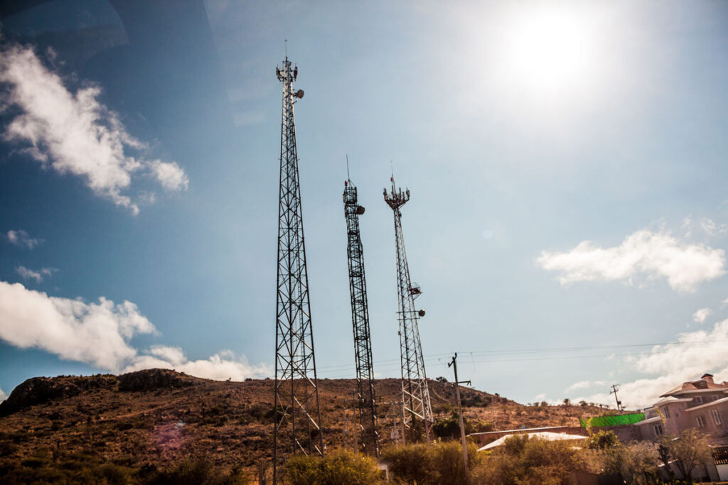 Radio towers in a desert against a blue sky, representing FCC fines for illegal radio operators