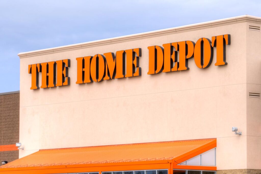 Close up of the Home Depot signage against a bright blue sky, representing the Home Depot lawsuit.