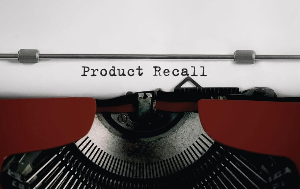 Text PRODUCT RECALL typed on retro typewriter