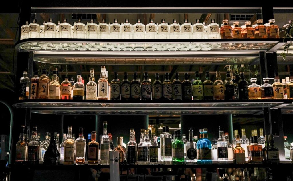 Bar shelves filled with bottles, representing the Diddy Diageo lawsuit.