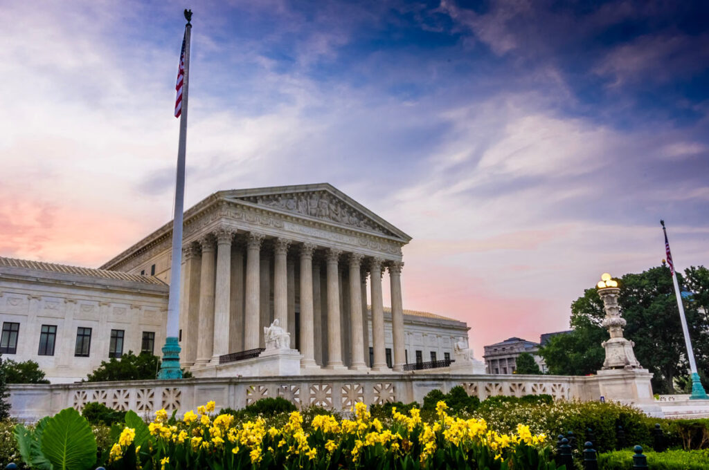 U.S. Supreme Court building against a sunset sky, representing the Supreme Court’s decision to hear a case on the United States’ repatriation tax.