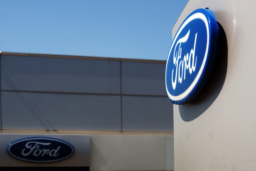Close up of Ford dealership signage, representing Ford recalls and lawsuits.