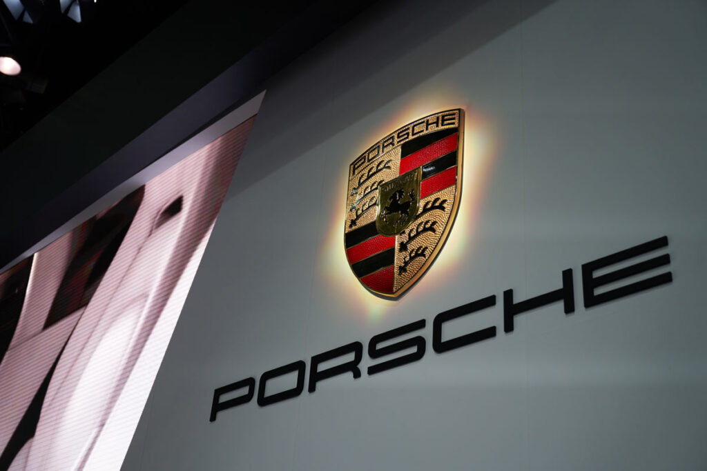 Close up of Porsche signage, representing the Porsche communication management system class action lawsuit settlement.