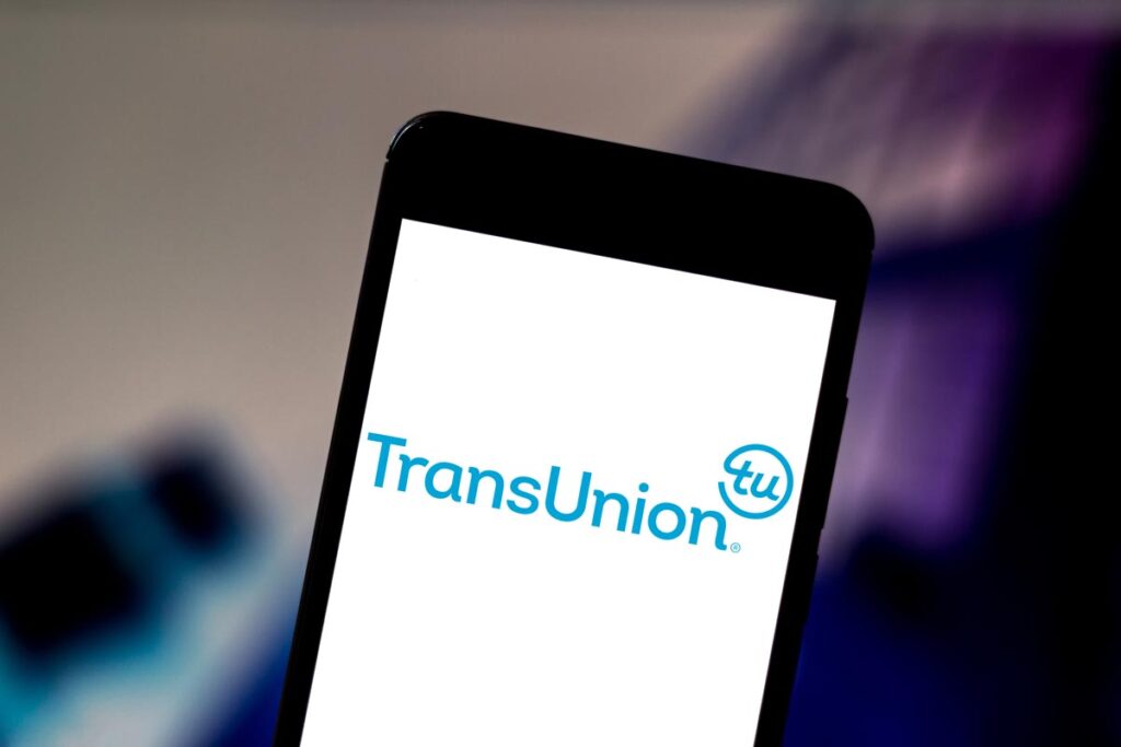 TransUnion logo displayed on a smartphone screen, representing the TransUnion Rental Screening Solutions settlement.