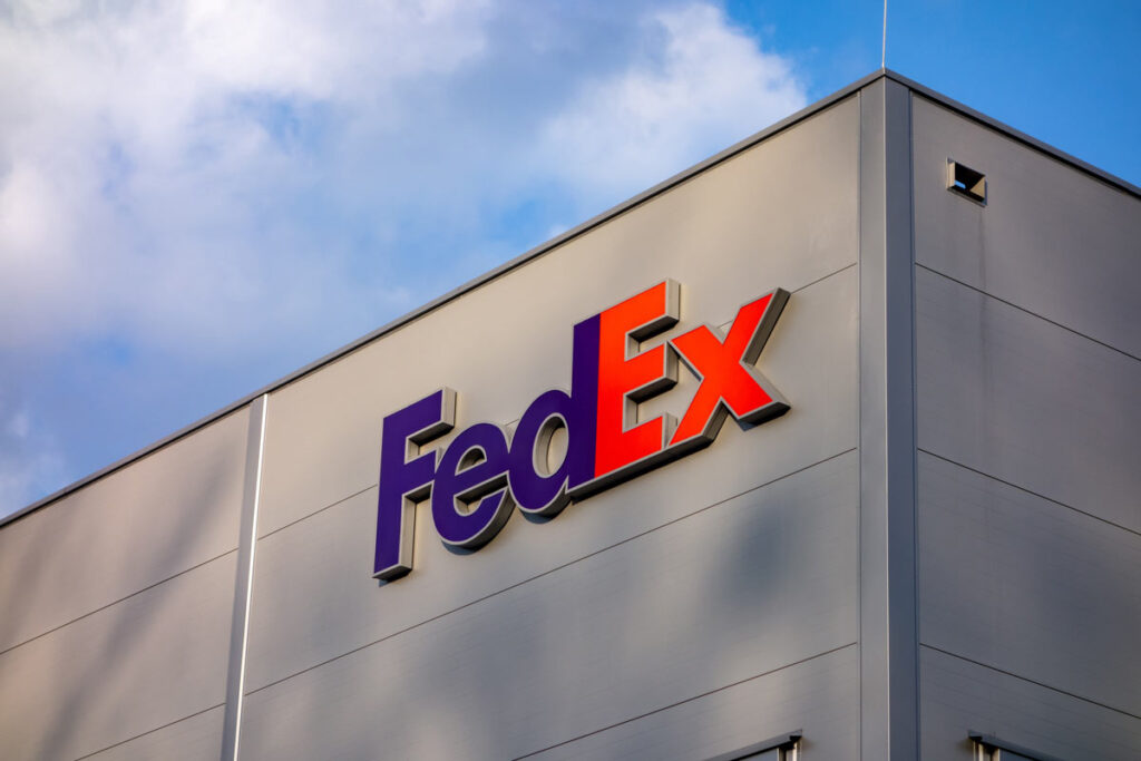 Close up of FedEx signage against a blue sky, representing the FedEx paid military leave settlement.