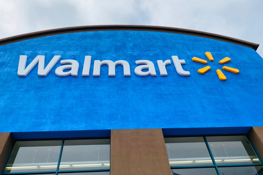 Close up of Walmart signage on exterior of one of its stores, representing recent Walmart lawsuits.