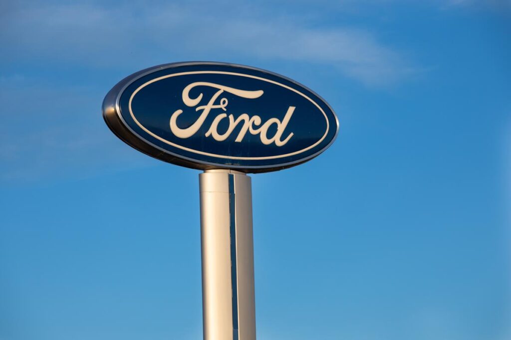 Close up of Ford signage against a blue sky, representing the Ford recall.