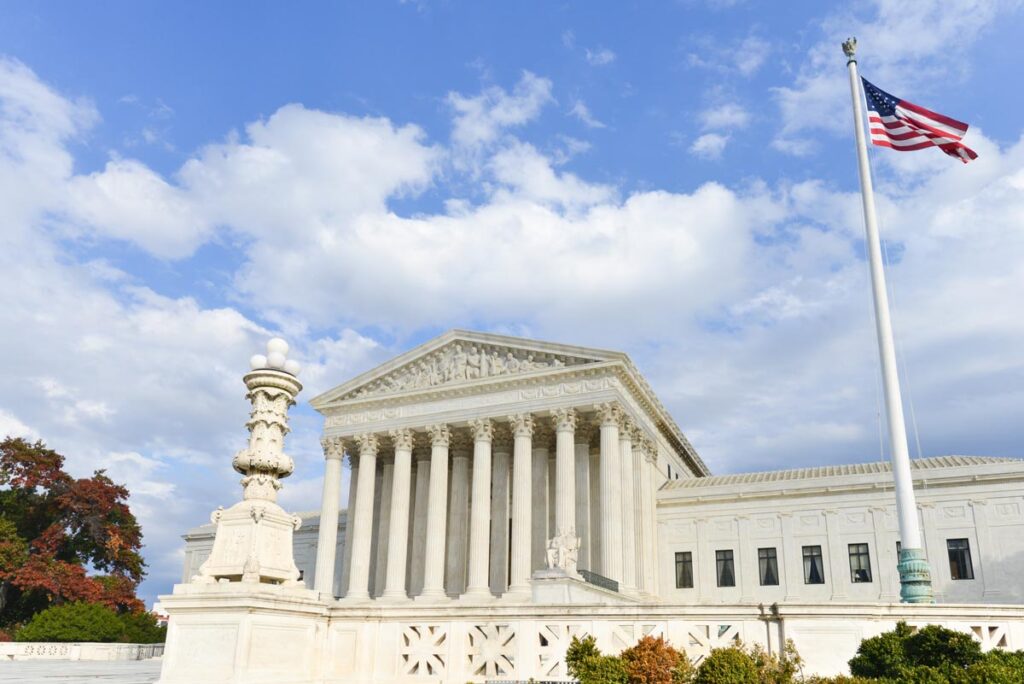 U.S. Supreme Court building against a blue sky, Representing the Supreme Court ruling on the Indian Child Welfare Act.