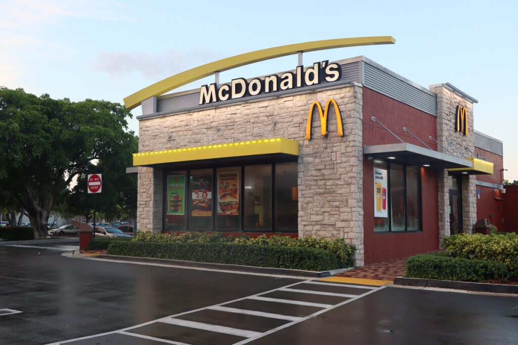Exterior of a McDonald's, representing the McDonald's Equal Employment Opportunity Commission (EEOC) sexual harassment settlement.