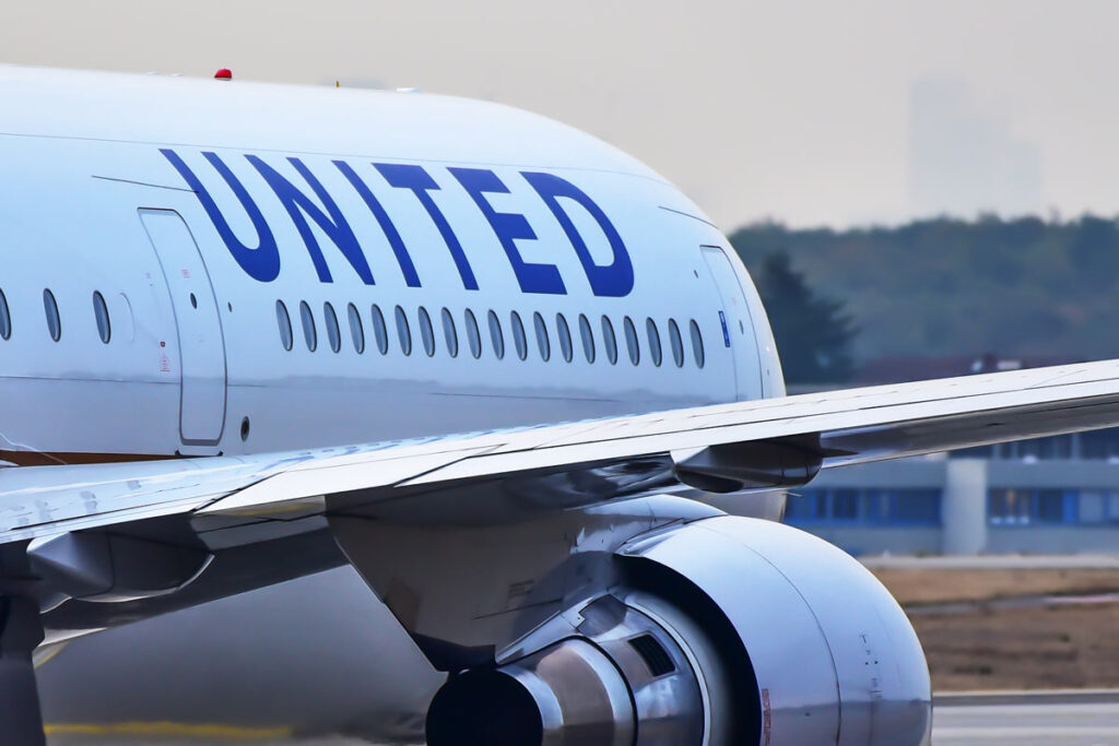 Close up of United Airlines logo on the side of a plane, representing the United Airlines class action.