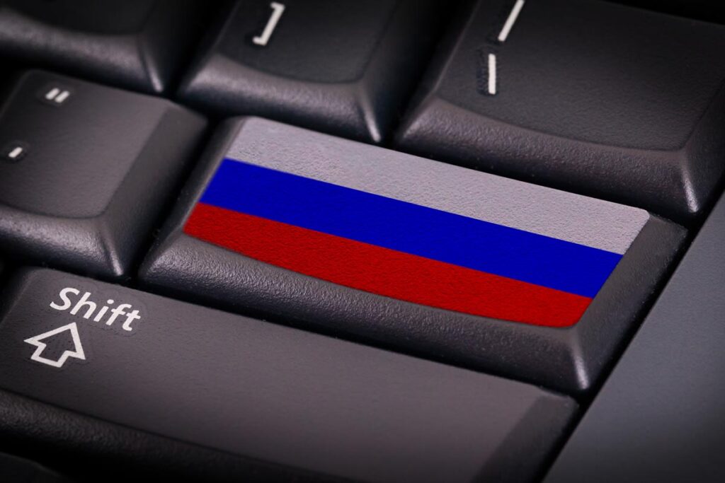 Close up of Russia flag on keyboard, representing the CL0P cyberattacks.