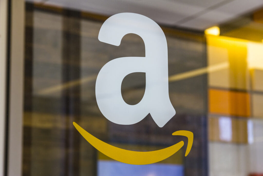 Close up of Amazon logo on a window, representing the FTC Amazon Prime auto renewal lawsuit.