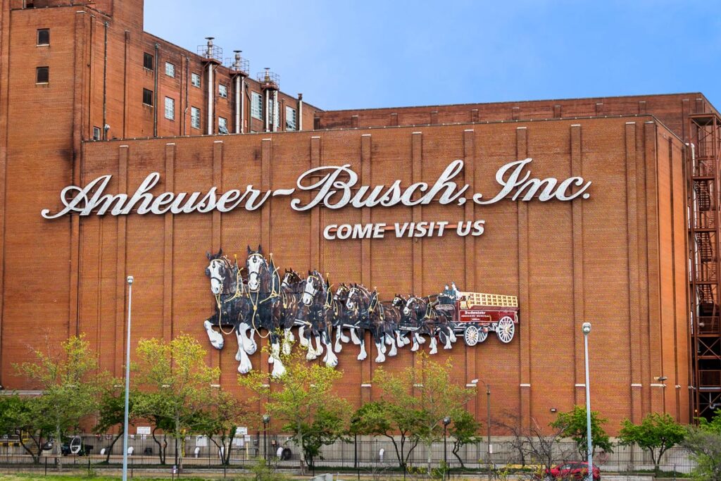 An Anheuser-Busch facility against a blue sky, representing the Anheuser-Busch settlement.