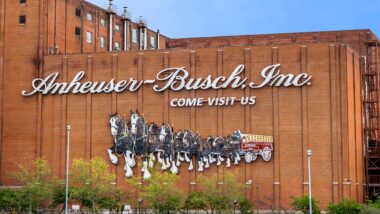 An Anheuser-Busch facility against a blue sky, representing the Anheuser-Busch settlement.