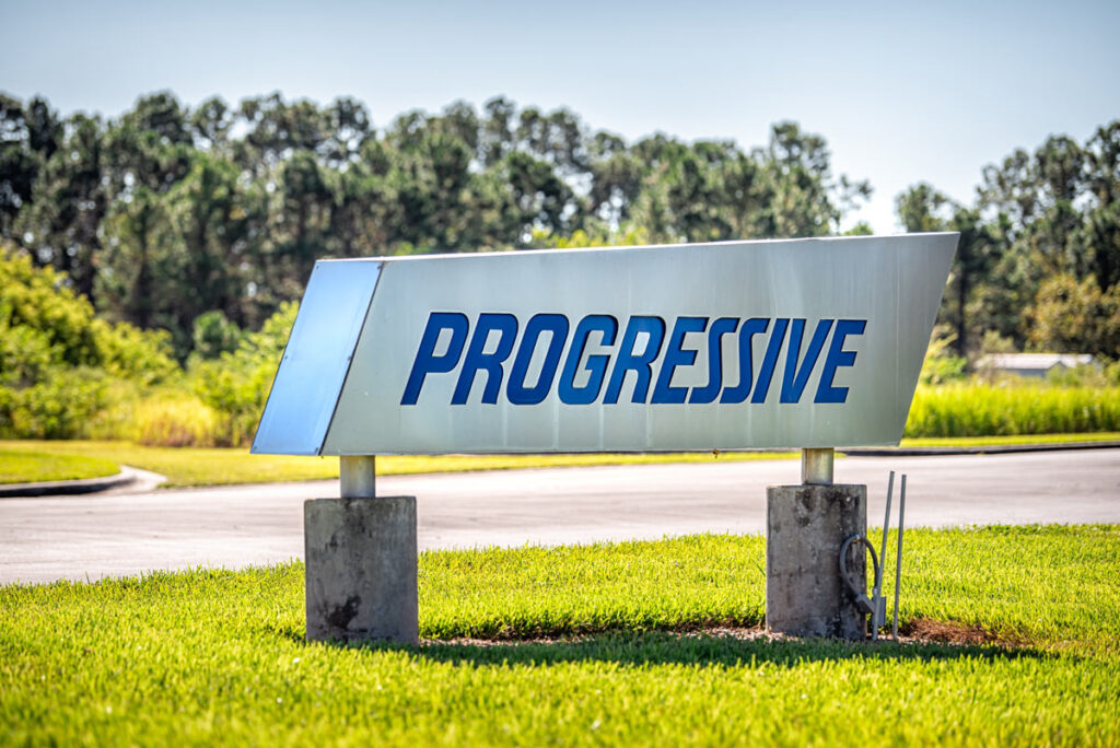 Progressive signage, representing the Progressive underinsured motorist settlement.