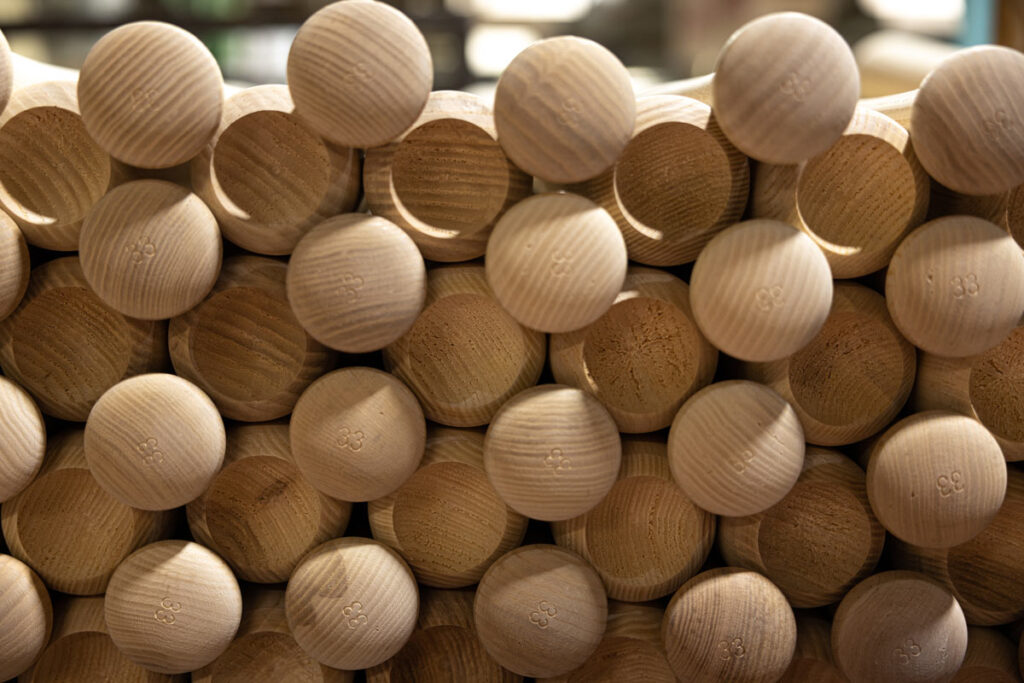 Close up of a pile of wooden baseball bats, representing the Chandler bats lawsuit.
