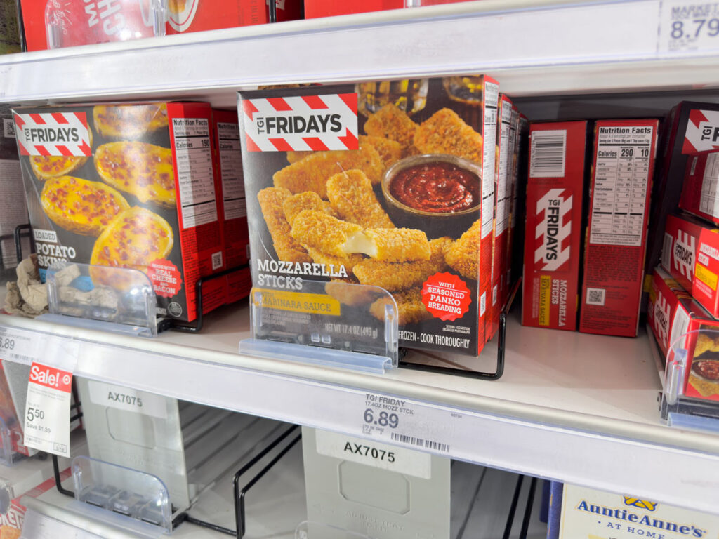 TGI Friday's mozzarella sticks in a grocery store freezer, representing the Inventure Foods class action lawsuit settlement.