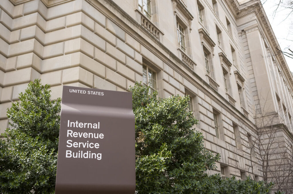 Close up of IRS signage outside a building, representing IRS visits.