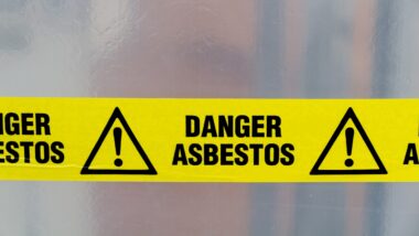 Danger Asbestos yellow warning tape, A diagnosis of lung cancer after exposure to asbestos may give you a legal claim.