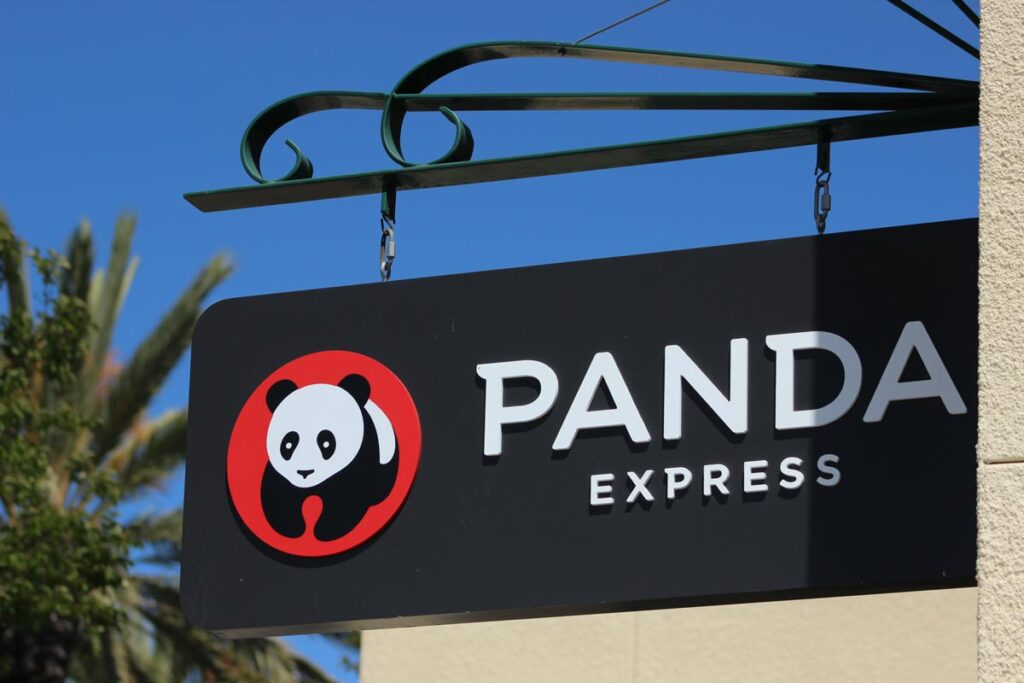 A Panda Express sign on a building, representing the Panda Express delivery service fee class action lawsuit settlement.