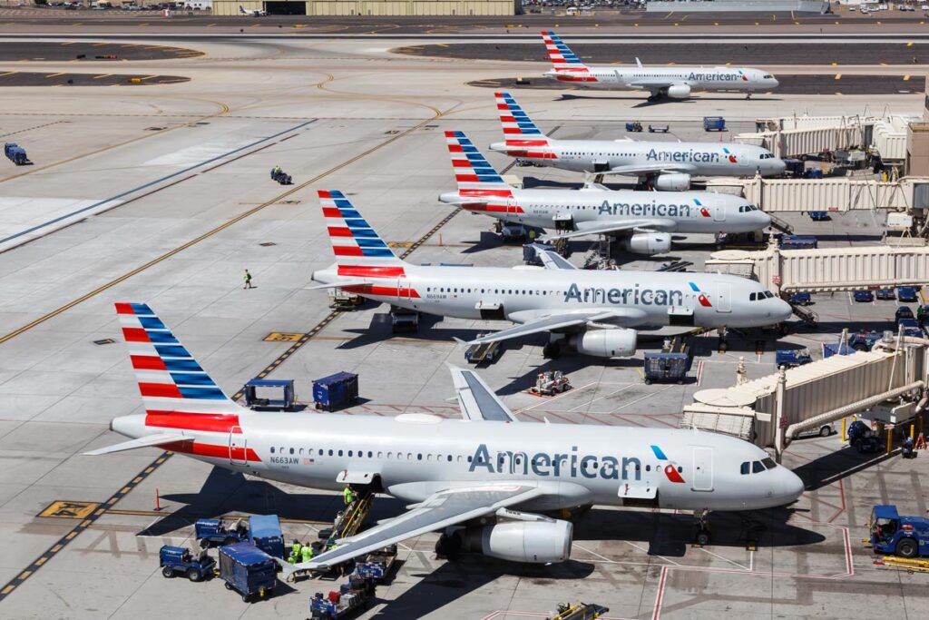 Various American Airlines plane at various terminals, representing the American Airlines Skiplagged lawsuit.