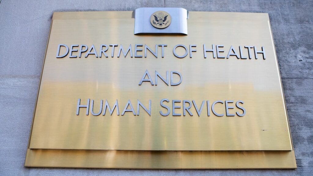 Department of Health and Human Services sign on HHS building, representing the new program for drug price negotiations 