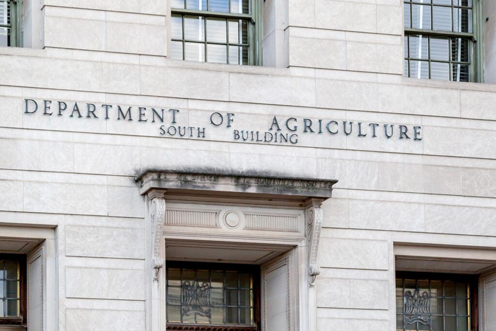 Close up of Department of Agriculture signage, representing USDA farmers.