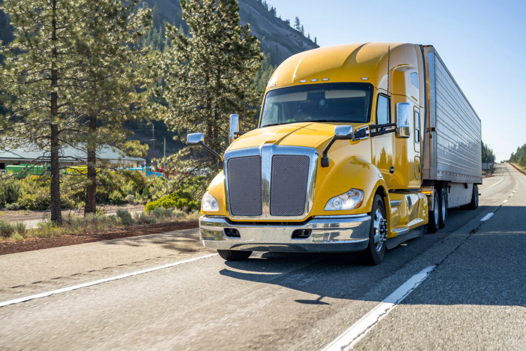 A semi driving along the road, representing the Yellow layoffs class action.