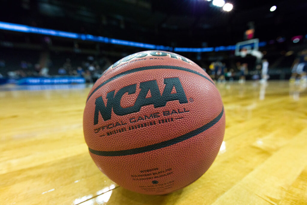 Close up of NCAA logo on a basketball, representing the NCAA discrimination class action.