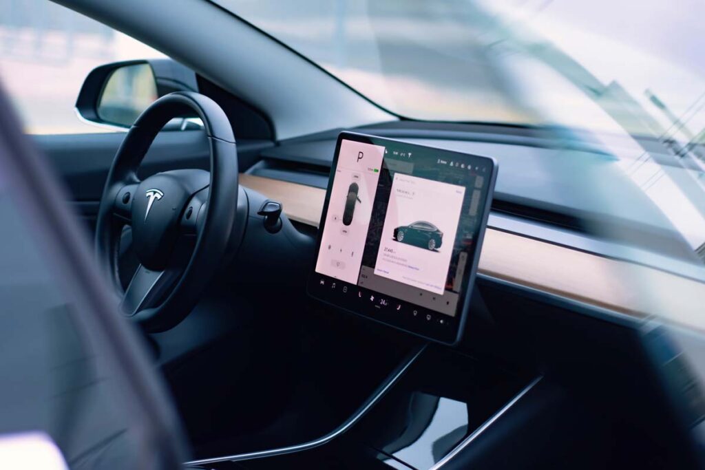 Interior of a Tesla, representing the Tesla Autopilot and Full Self-Driving systems.