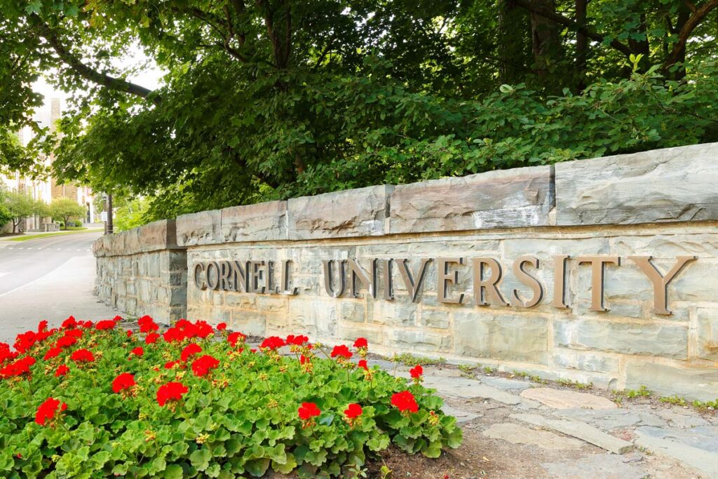 Close up of Cornell University signage, representing the Cornell COVID-19 tuition class action lawsuit settlement.