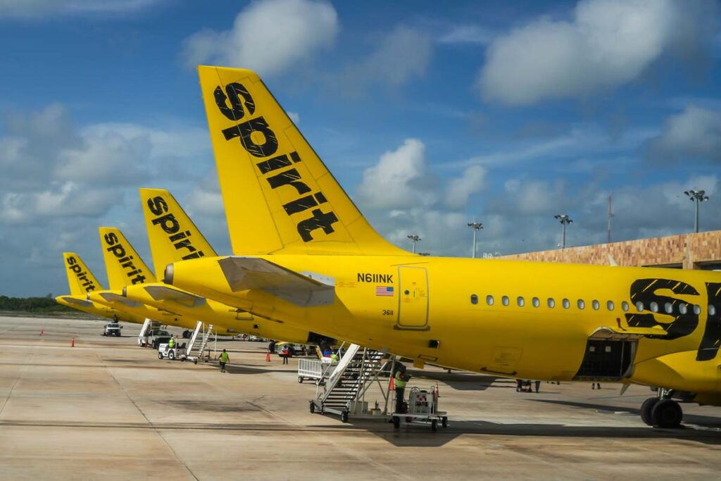 Numerous Spirit Airlines planes at an airport terminal, representing the Spirit FMLA class action.