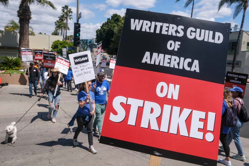 Large Writers Guild of America on strike sign, representing the Hollywood writers strike.