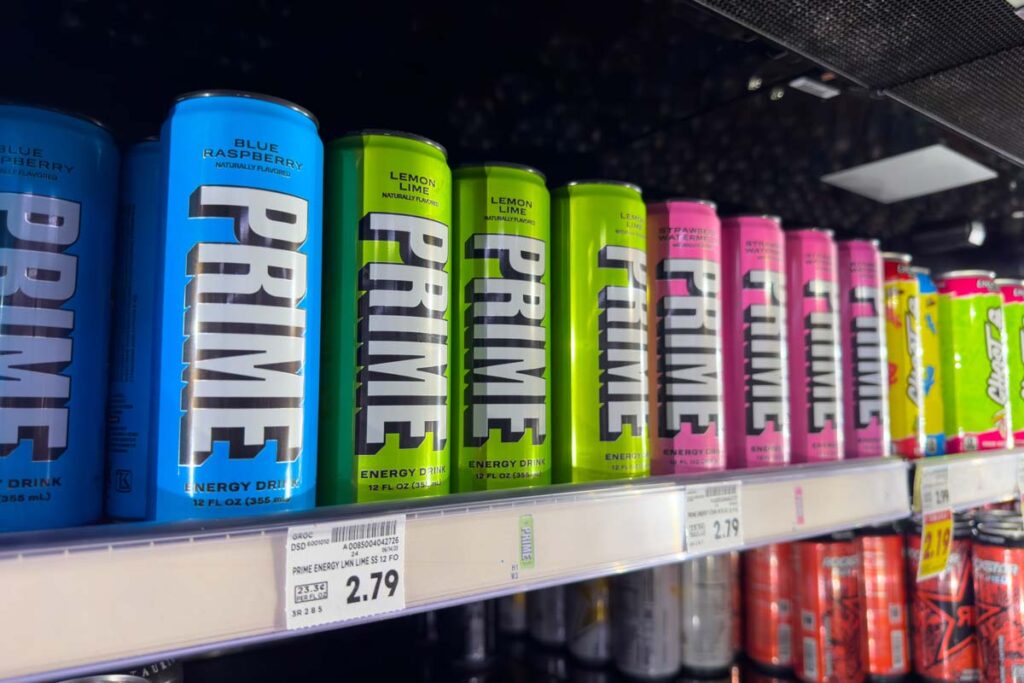 Prime drinks on a grocery store shelf, representing cold and allergy medicine.