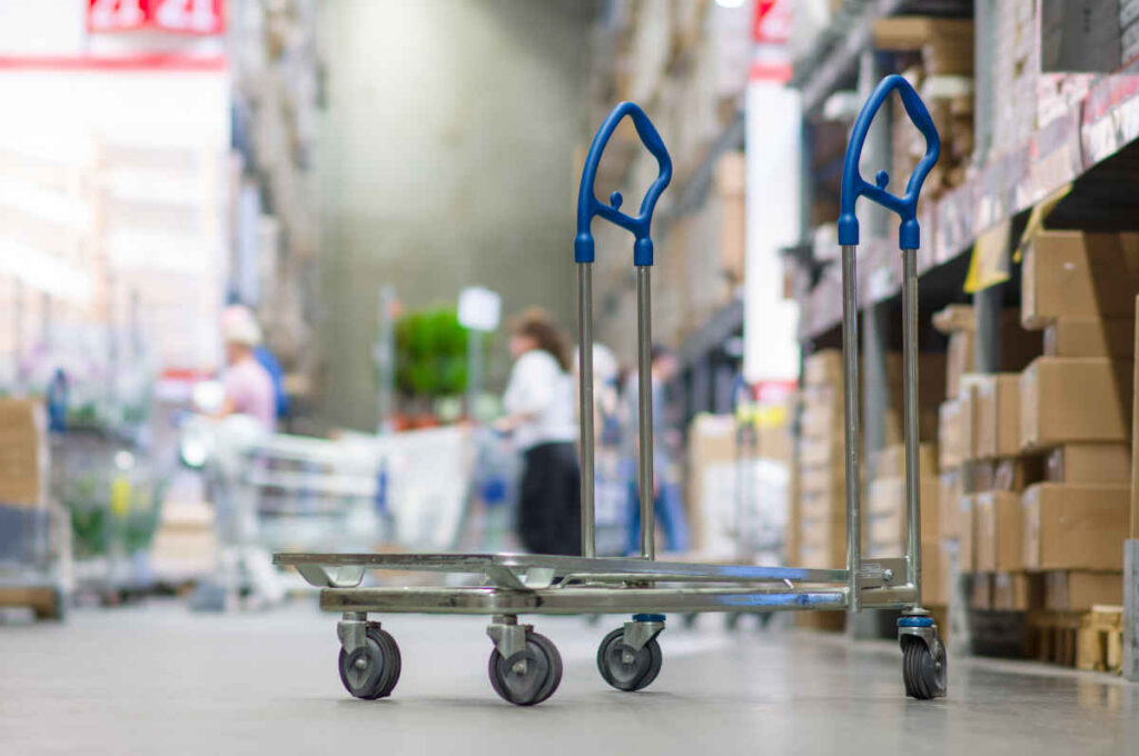 Rows of shelves with boxes and storage carts in modern warehouse representing top recalls for the week of Sept. 25.