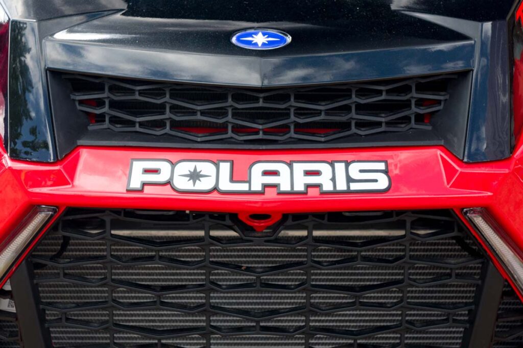 Close up of Polaris logo on bumper of a UTV vehicle, representing recent Polaris recalls.