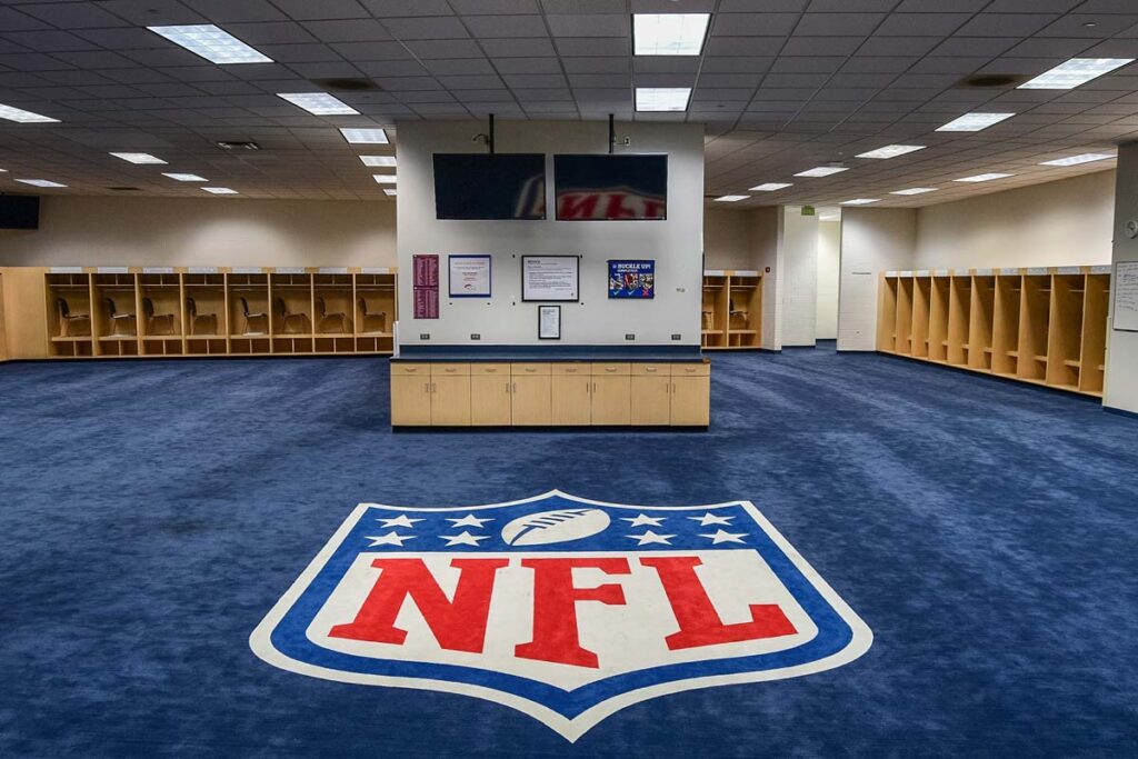 NFL logo on floor of a locker room, representing the NFL race-norming lawsuit.