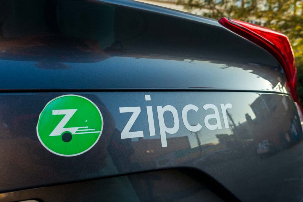 Close up of Zipcar logo on the back of a vehicle, representing the NHTSA Zipcar fines.