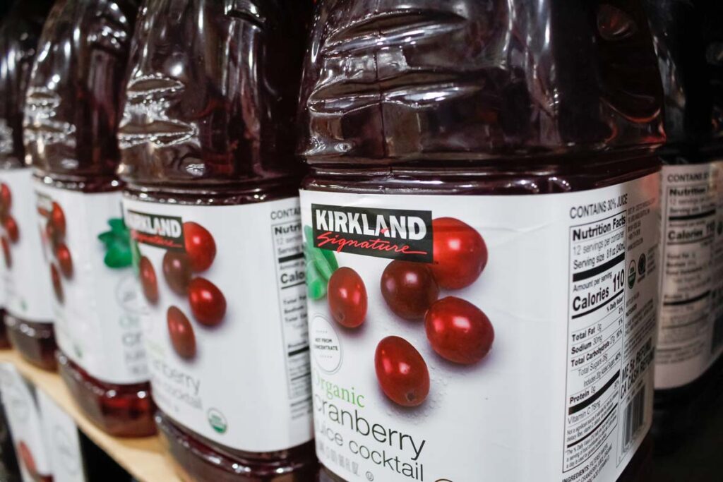 Close up of Kirkland raspberry juice on a grocery store shelf, representing the Costco cranberry juice class action.