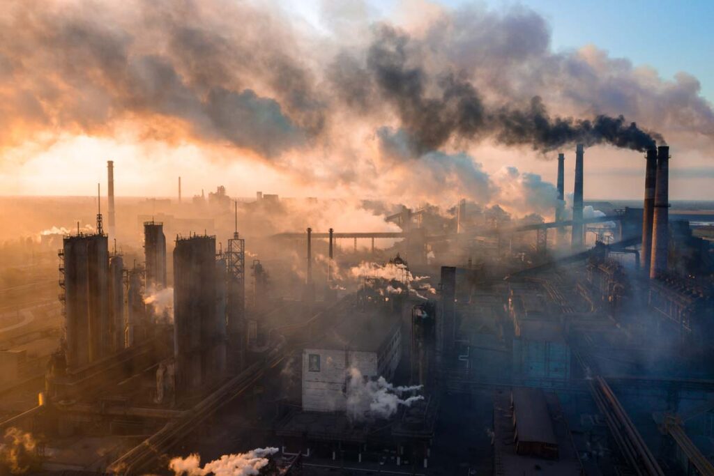 Industry plant producing smog, representing recent environmental lawsuits.