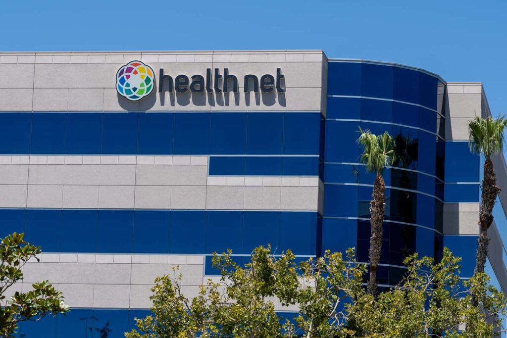 Health Net signage on an office building, representing the Health Net class action settlement.
