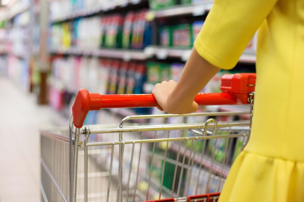 Close up of a woman pushing a shopping cart, representing top recalls for the week of Oct. 2.