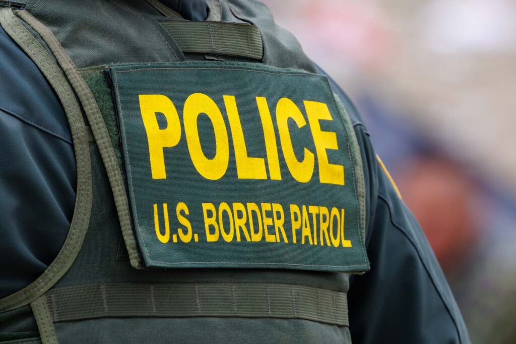 Close up of a U.S. Border Patrol uniform, representing the border wall.